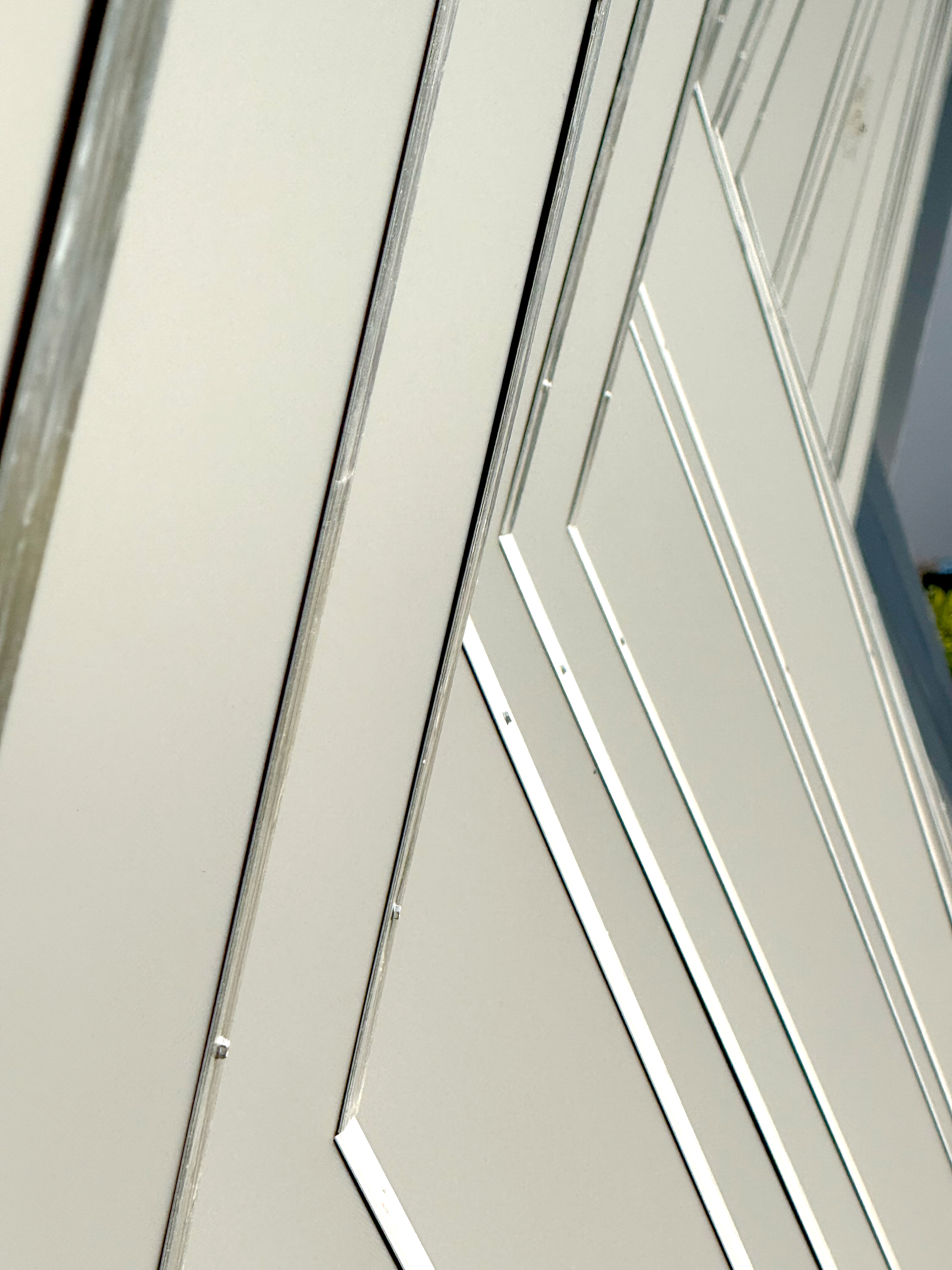 A side view of the facade panels lined up next to each other showing the variety in the shape of the facade.