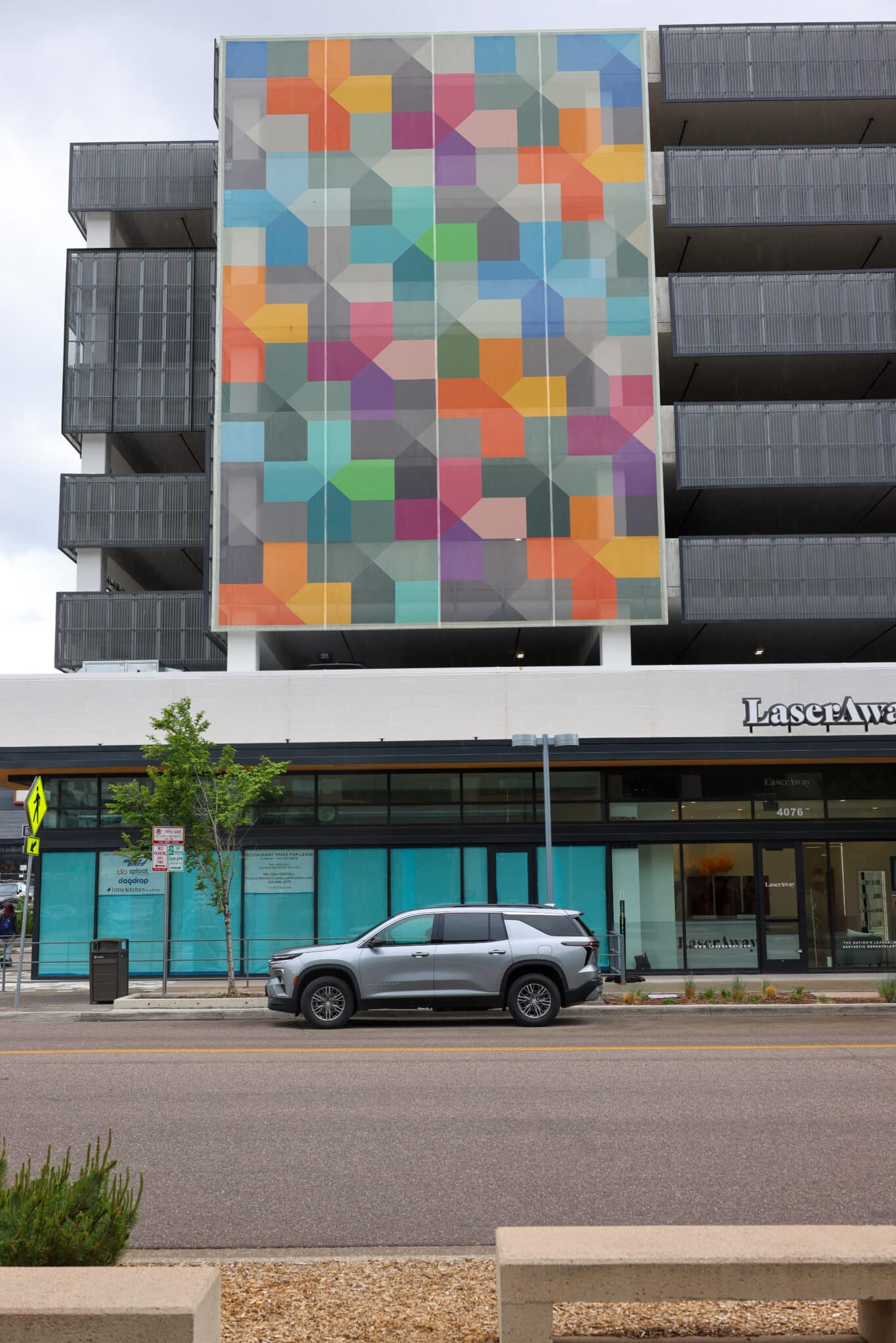 A full shot of the facade that showcases the vibrant colors and geometries of the pattern.