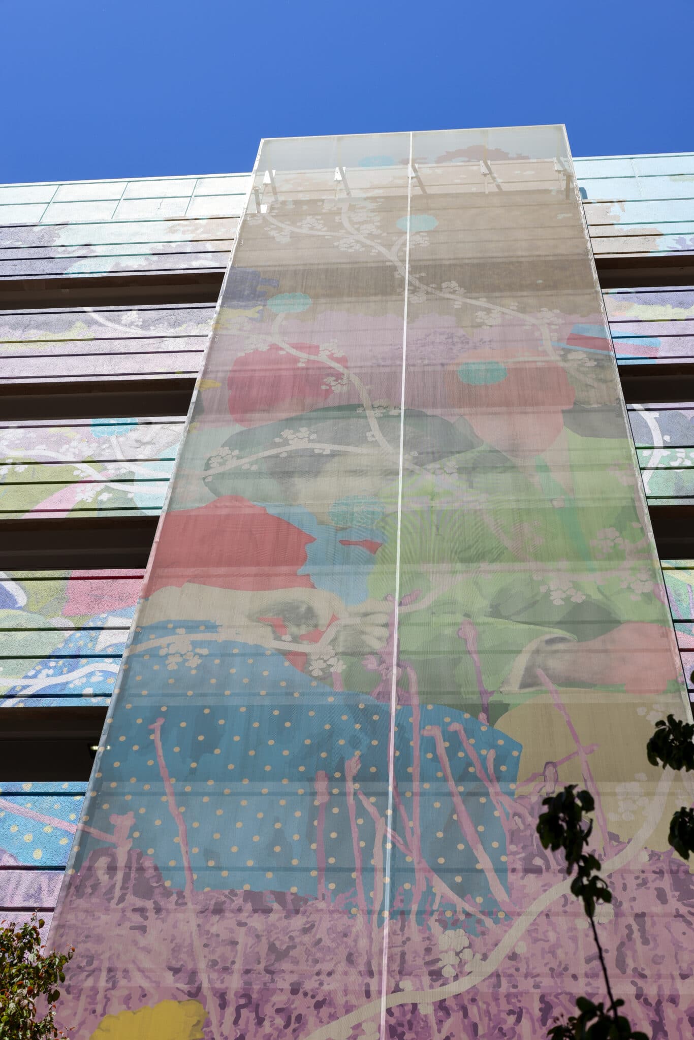 A colorful Ventilated PES facade that sits on top of a matching paint job, creating a 3-D effect.
