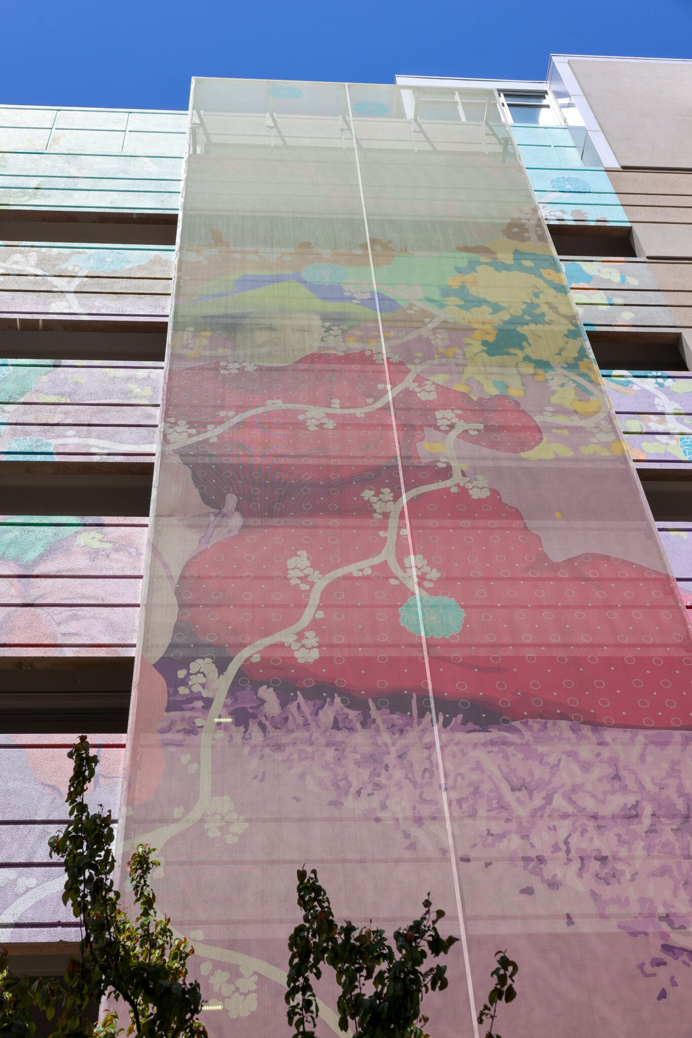 A colorful Ventilated PES facade that sits on top of a matching paint job, creating a 3-D effect.