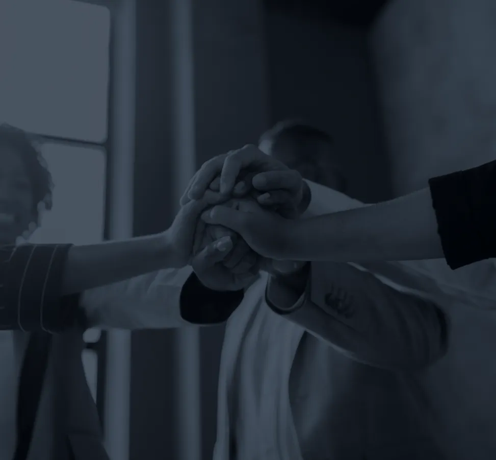 team with hands touching in the middle