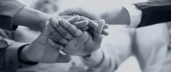 group with hands together in the middle