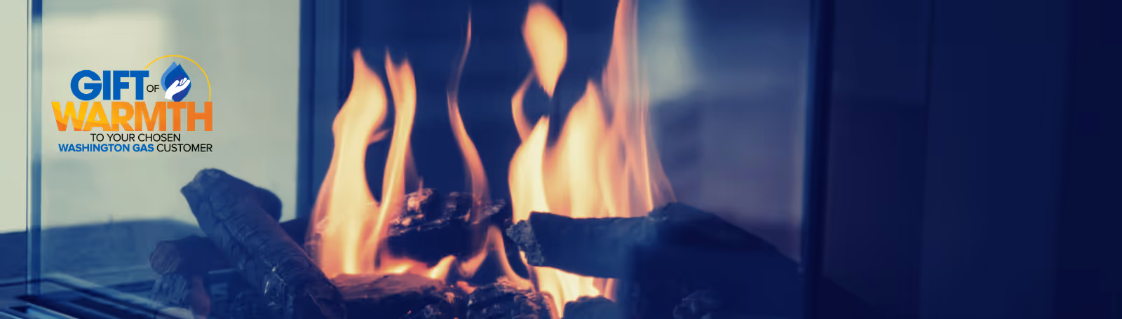 A glowing fire burning behind glass with the text 'Gift of Warmth to your chosen Washington Gas customer' on the left.