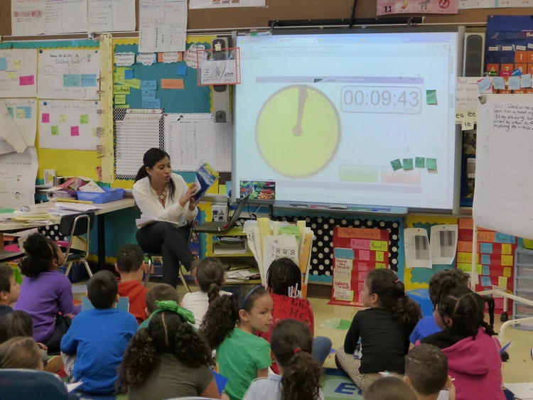Teacher leading a classroom lesson