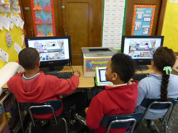 Students using computers in class.