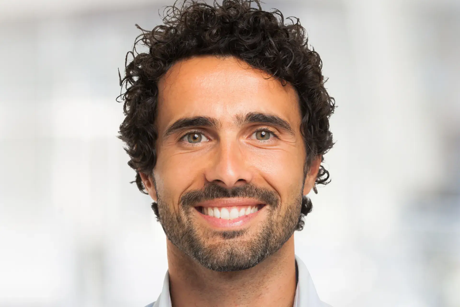 a close up of a person wearing a blue shirt