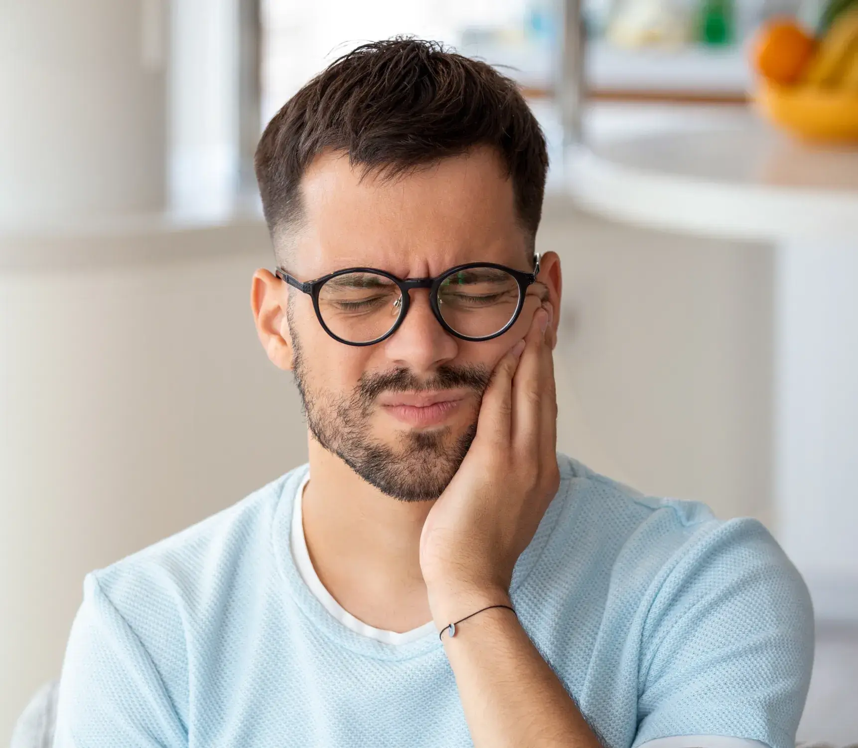a man with glasses is looking at something