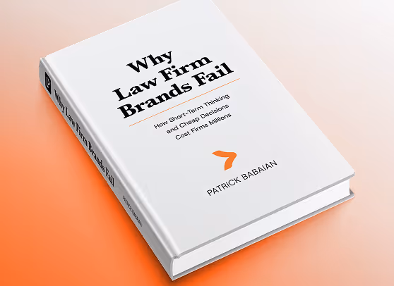 Book 'Why Law Firm Brands Fail' by Patrick Babaian on an orange surface.