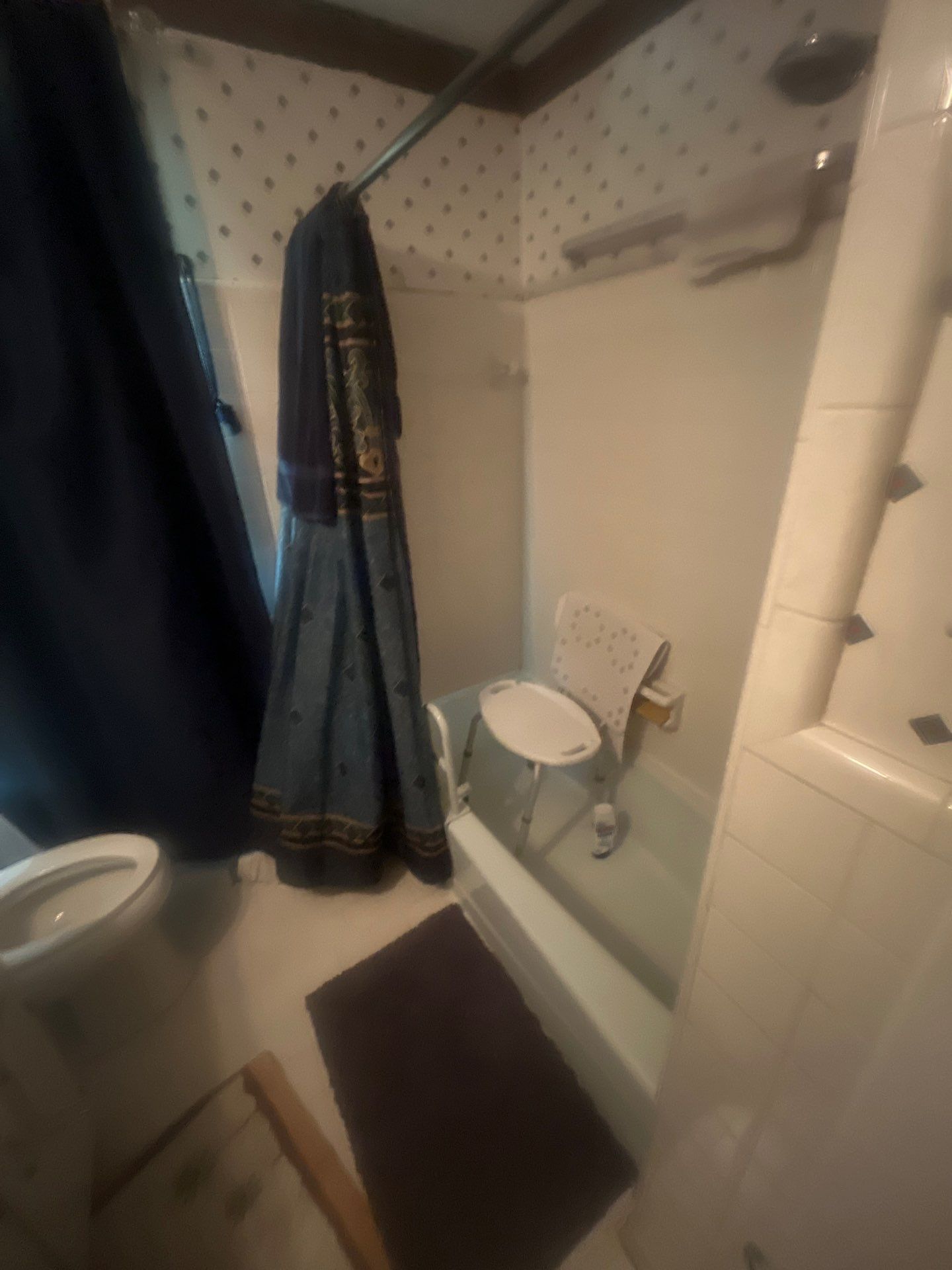 Before: old shower with curtain
