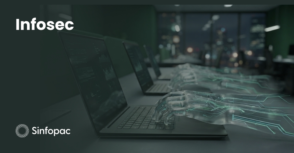 Laptops en oficina con manos digitales translúcidas que ilustran el riesgo de Shadow IT