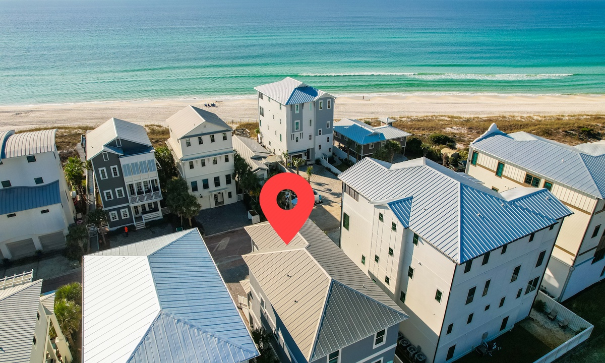 Drone photo of beach house location steps from the shoreline