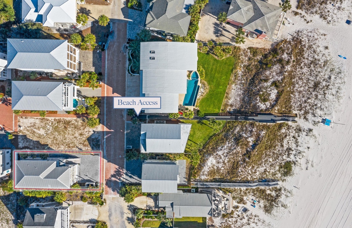 Overhead view of beach access and surrounding coastal homes