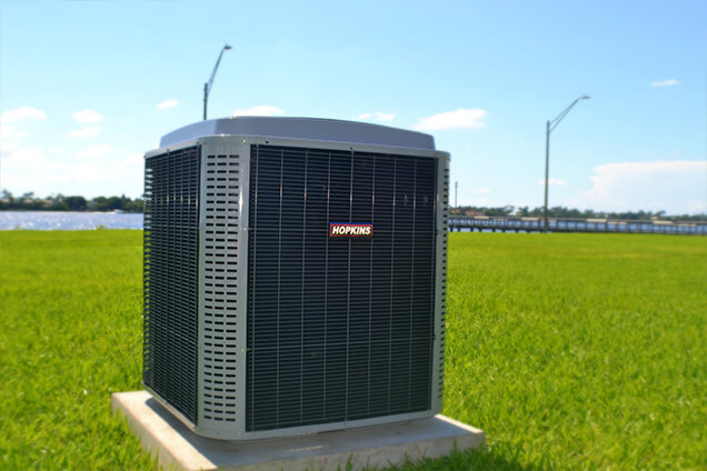 Hopkins AC brand outside on green lawn