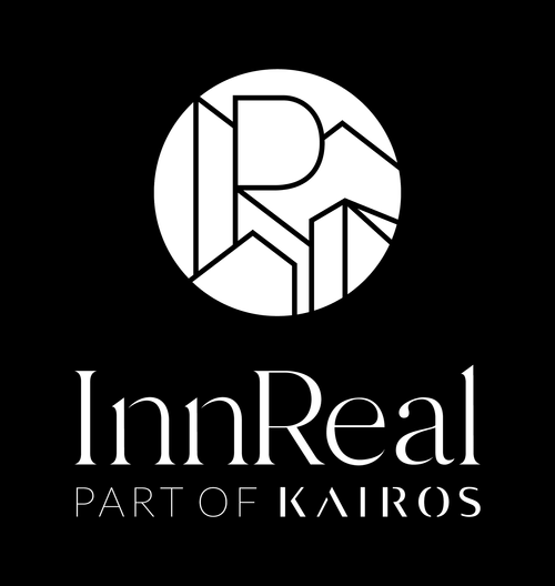 InnReal logo with geometric design above text and the phrase 'PART OF KAIROS' below.