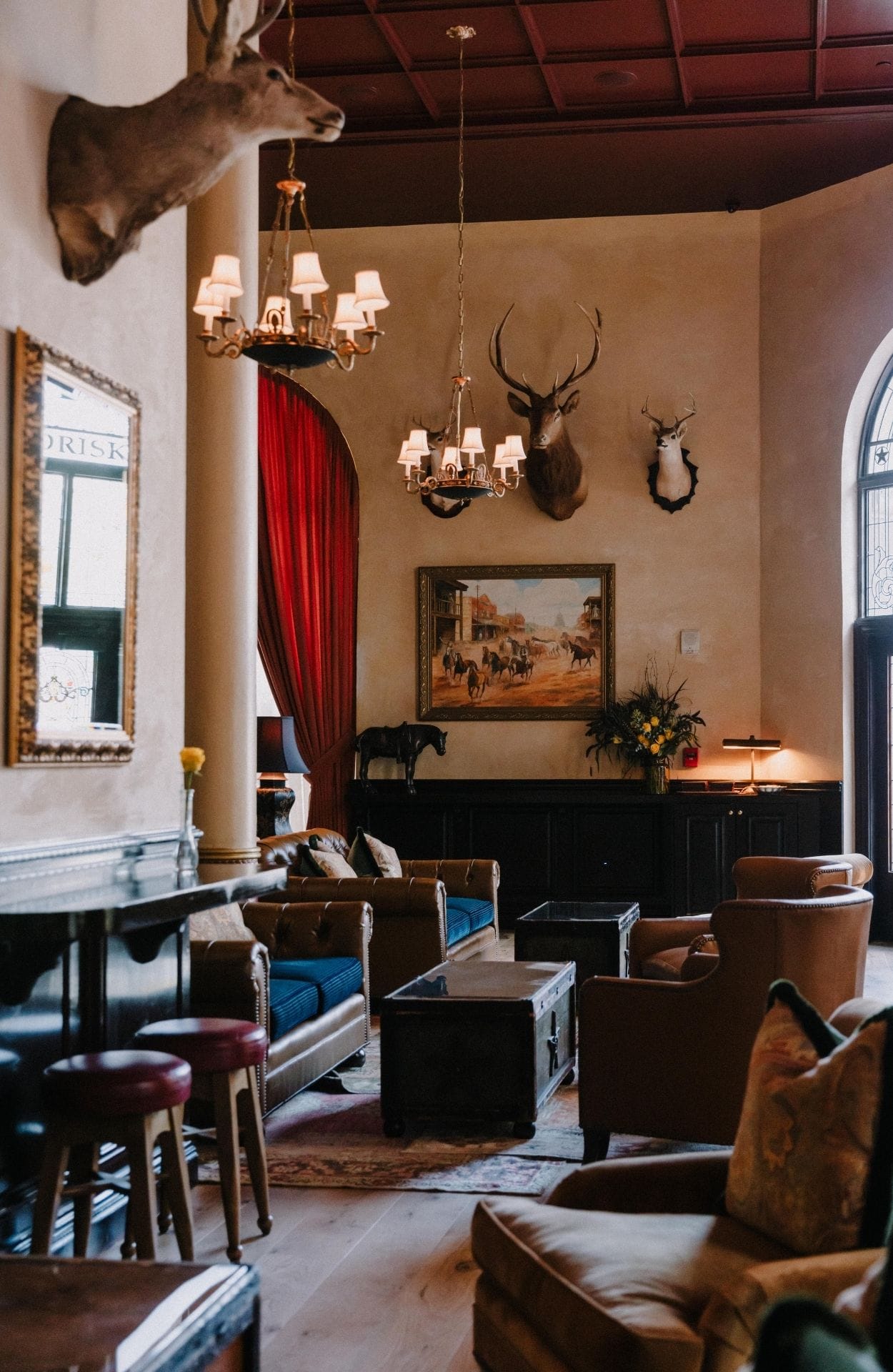 A vintage photograph of Western cowboys having a drink in a saloon-style bar