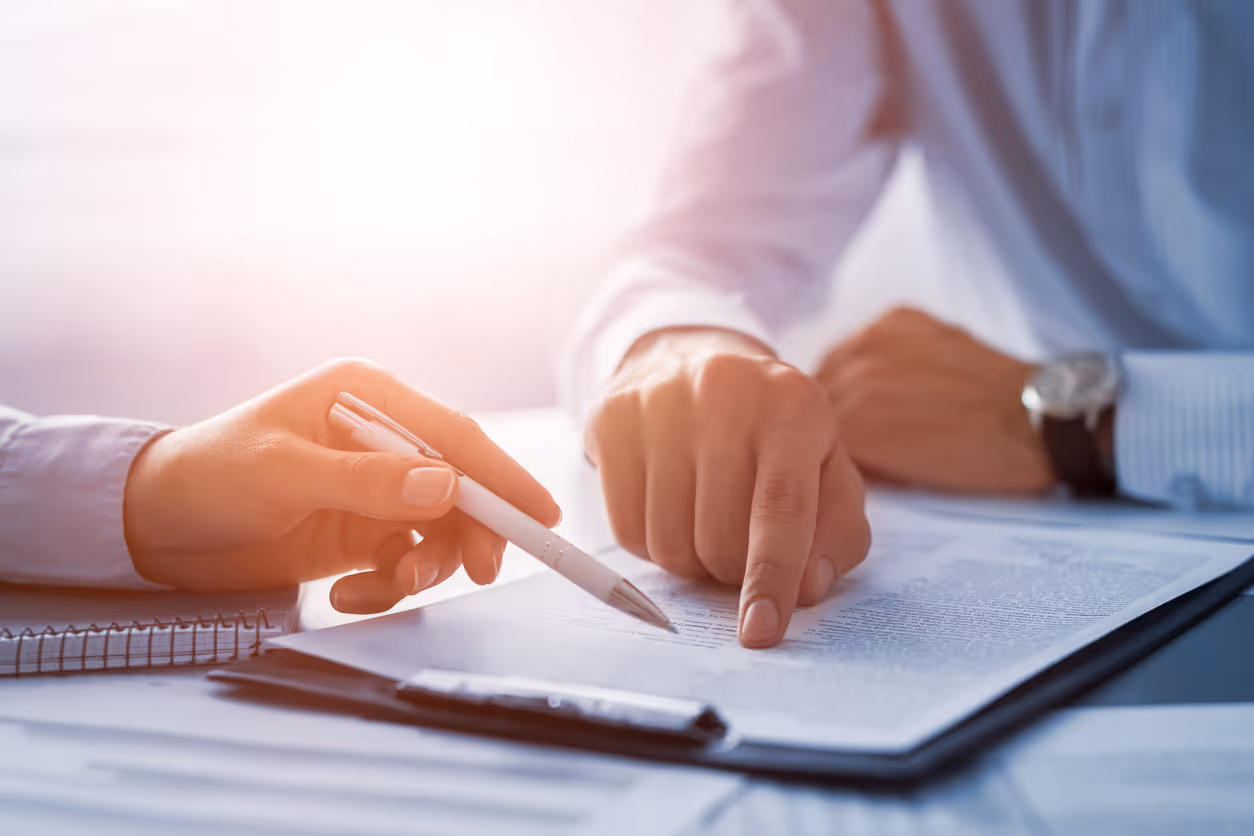 image of a notebook and a coffee cup on a desk