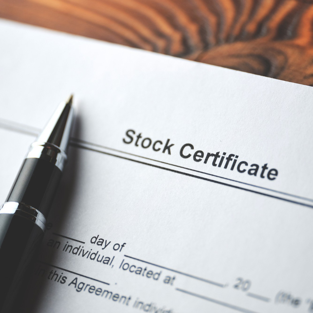 Filling in paperwork to buy a stock certificate