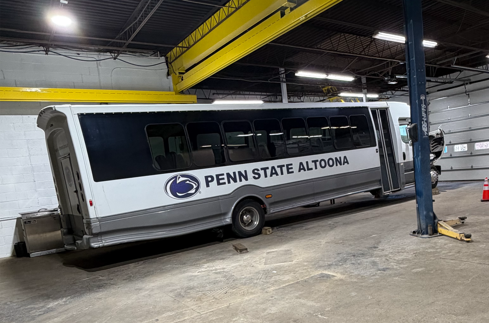 Bus under repair in repair shop in Franklin, PA