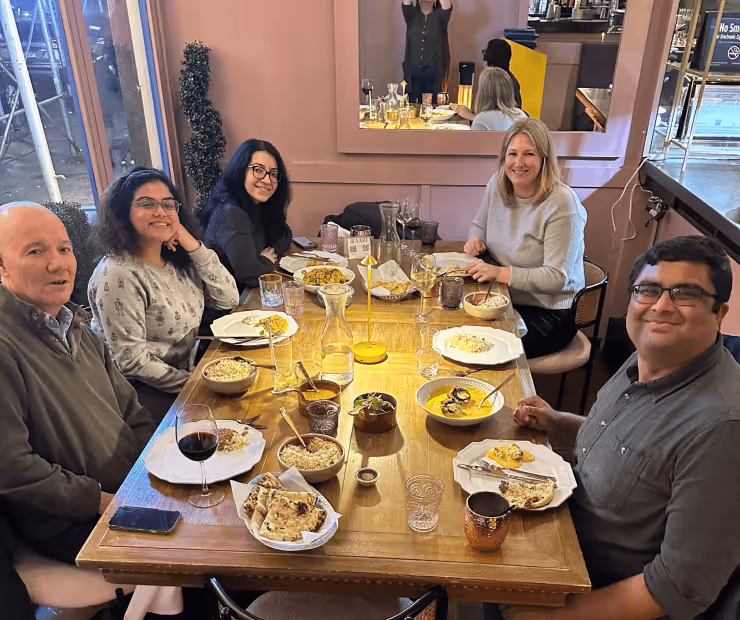 Lab members celebrate together at a lab dinner