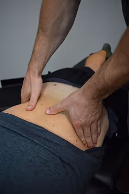 Ron Ayello performing chiropractic service