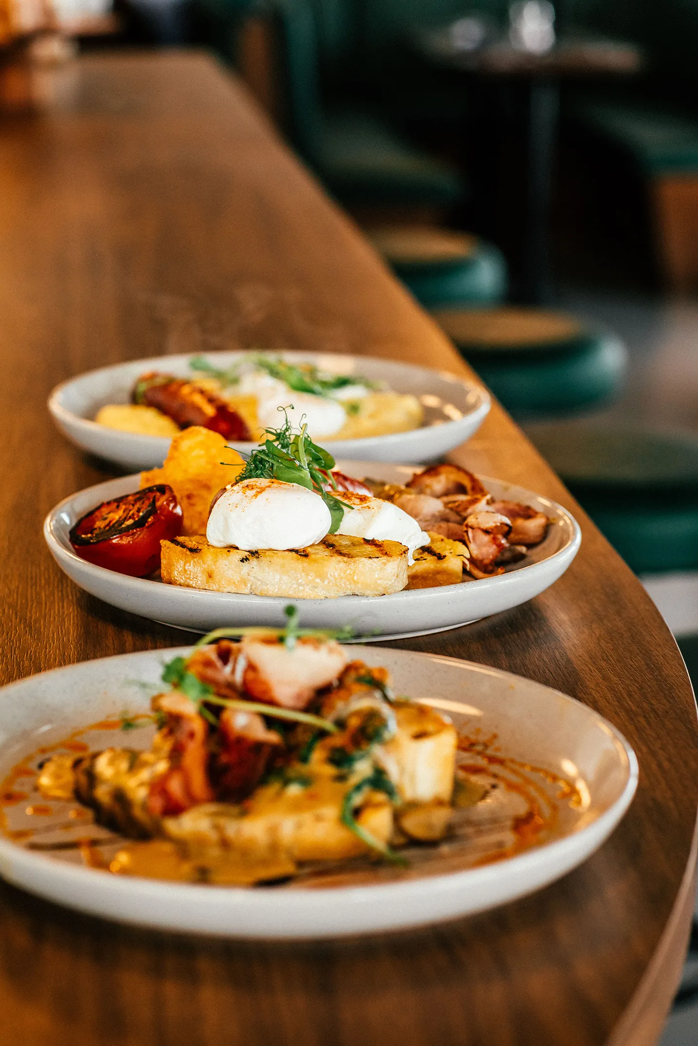 A selection of breakfast meals on display including our Sausages & Grits With Poached Egg and Big Breakfast