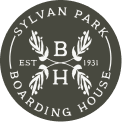 Sylvan Park Boarding House circular logo with EST B 1931 H and decorative leaves