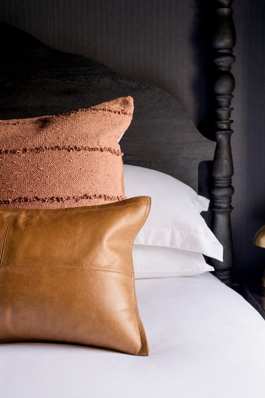 Close view of the bed and pillows, The Rawlings suite