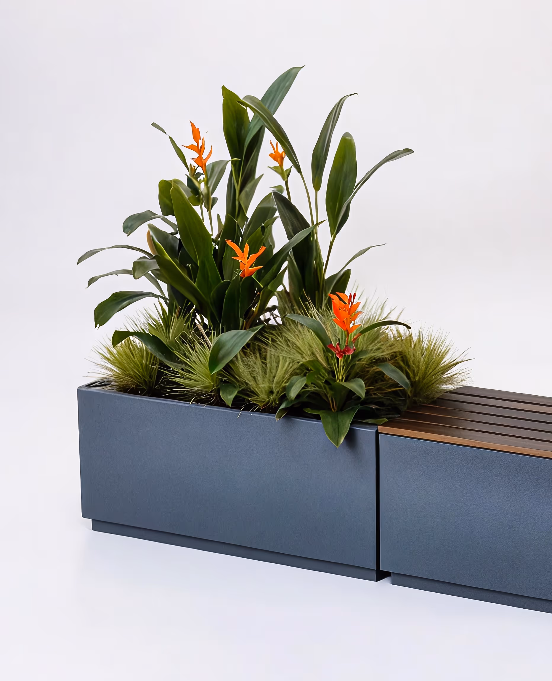A planter filled with lots of green and orange flowers.