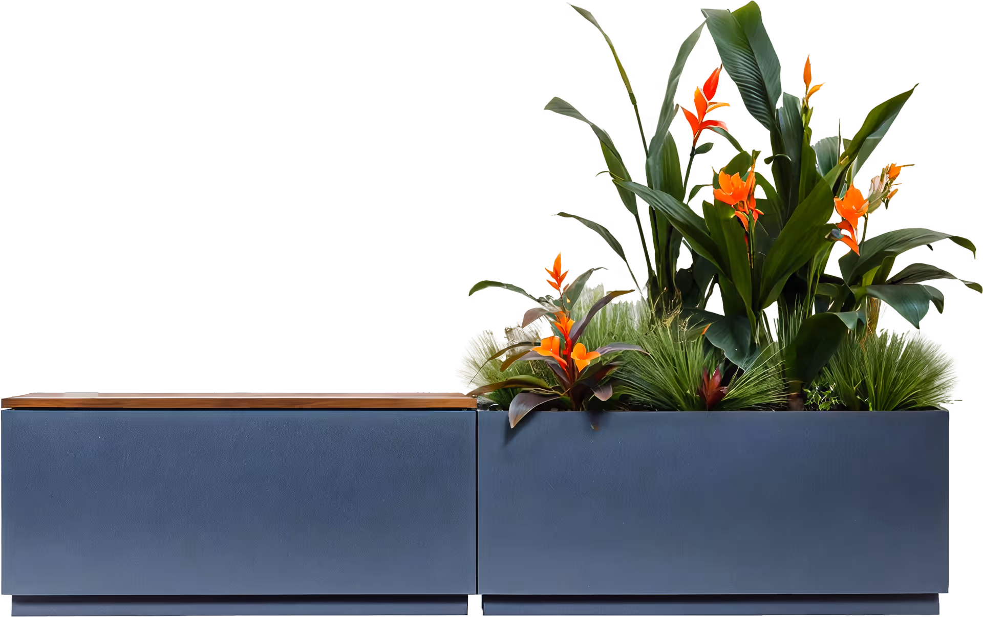 A planter filled with lots of flowers next to a wooden bench.