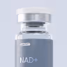 Close-up of a small clear glass medicine vial labeled 'affecty' with a gray rubber stopper and metal cap.