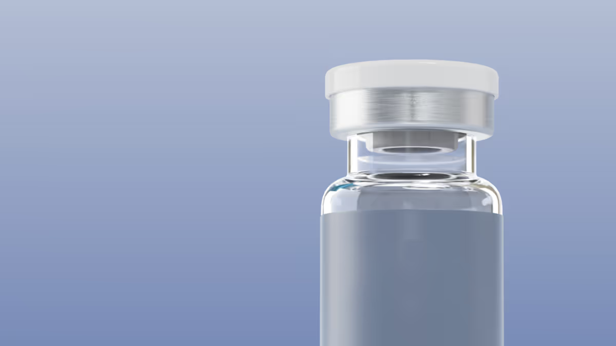 Close-up of a transparent vial with a gray label reading 'effecty.' and a white cap against a blue background.