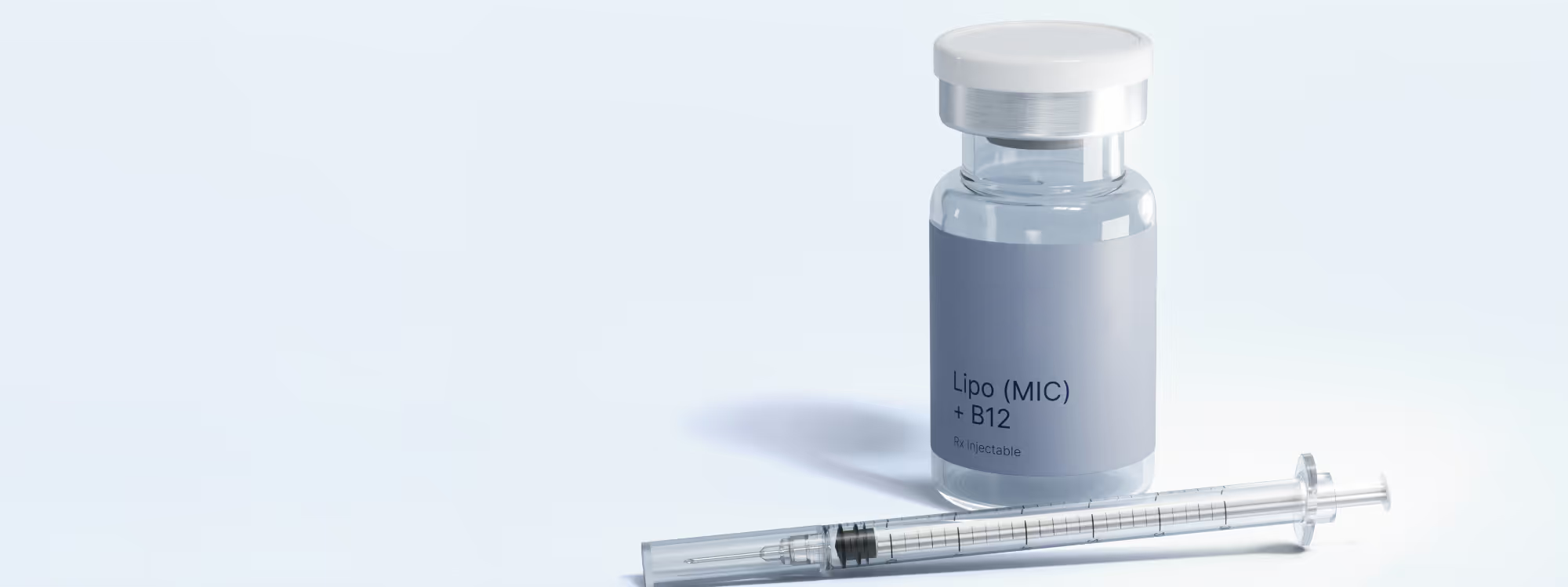 Vial labeled 'effecty Lipo (MIC) + B12' next to a syringe on a light surface.