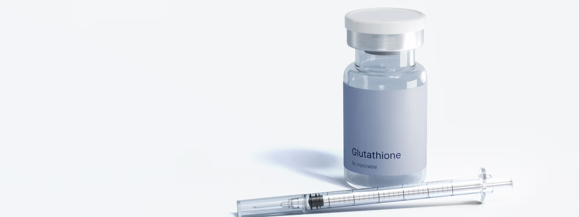 Clear vial labeled 'effecty Glutathione Rx injectable' next to a transparent syringe on a white surface.