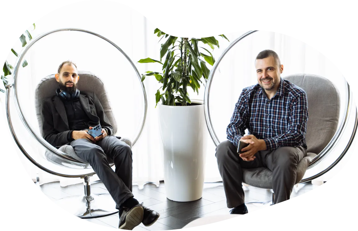 Employees from Jiminny's Bulgaria team sitting together working in modern office space