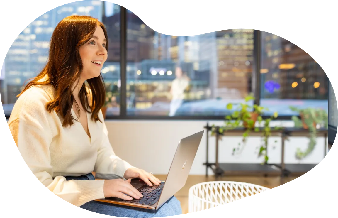 Female Jiminny employee working in shared working space in London