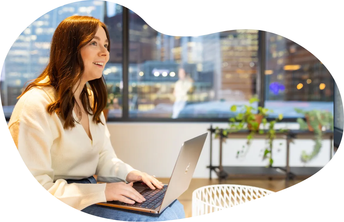 Female Jiminny employee working in shared working space in London