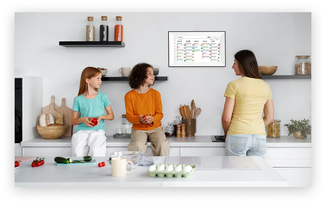A family organizing their schedule with Whale Framely Calendar