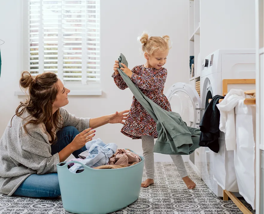 A parent and child enjoying everyday family life at home