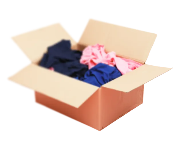 An open box with clothes inside of it.