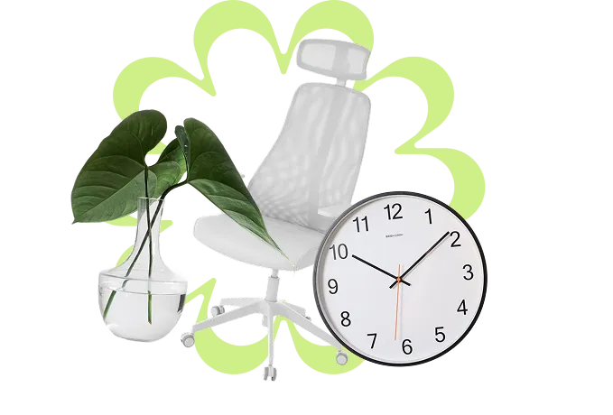 A clock with a plant in a vase next to it.