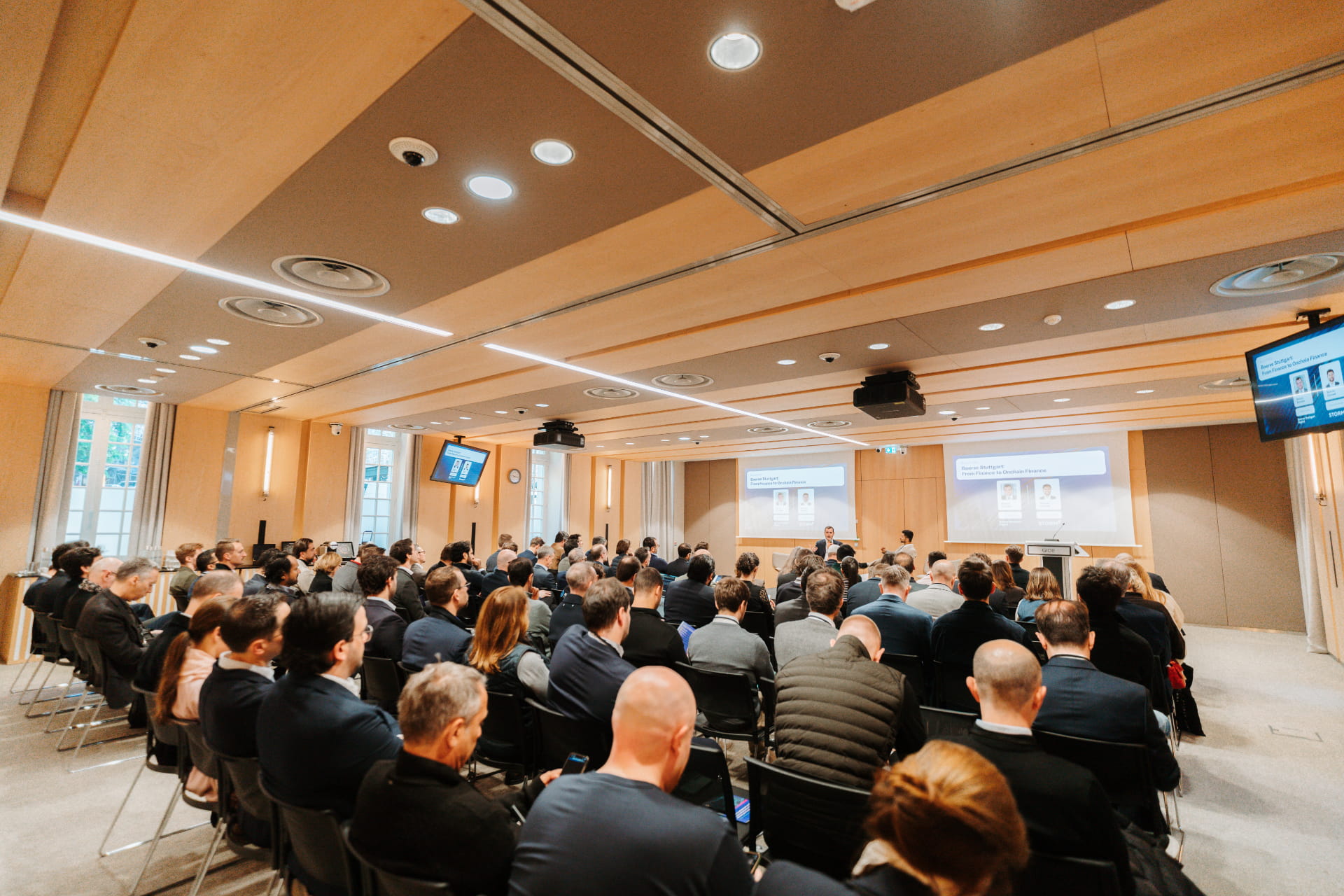 Corporate Breakfast panel audience in a conference room