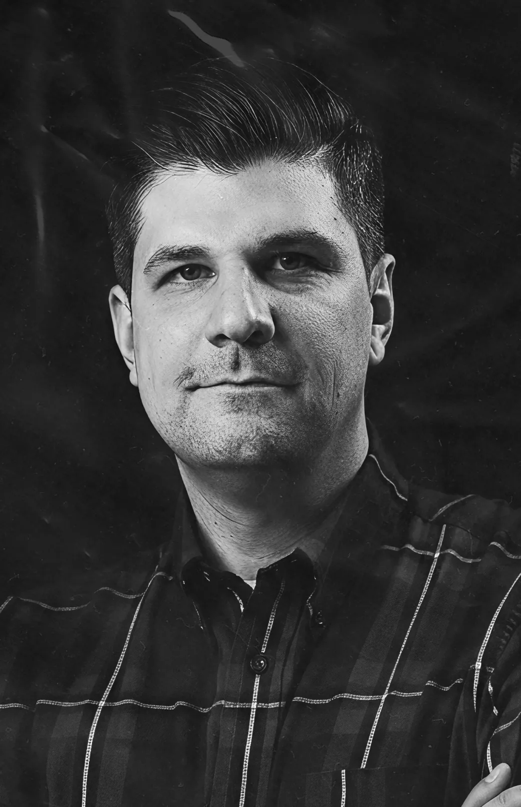 Team member headshot in black and white