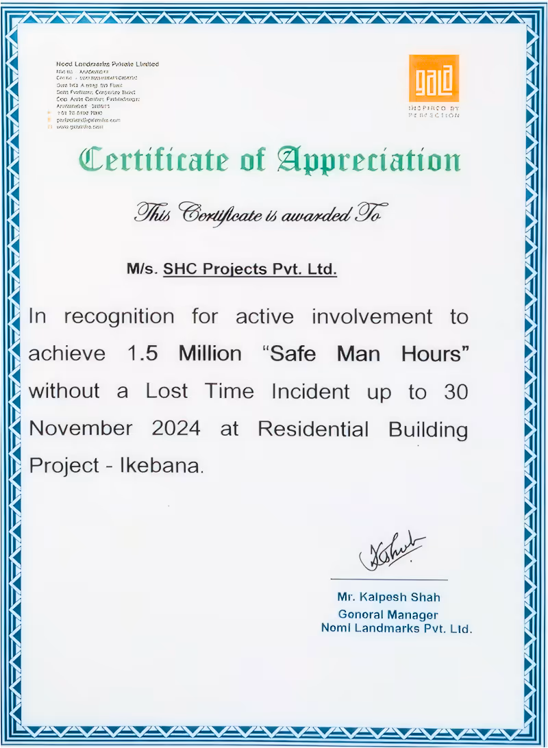 Certificate of Appreciation awarded to SHC Projects Pvt. Ltd. for achieving 1.5 million safe man hours without a lost time incident up to November 30, 2024, at Residential Building Project - Ikebana, signed by Mr. Kalpesh Shah, General Manager of Nomi Landmarks Pvt. Ltd.