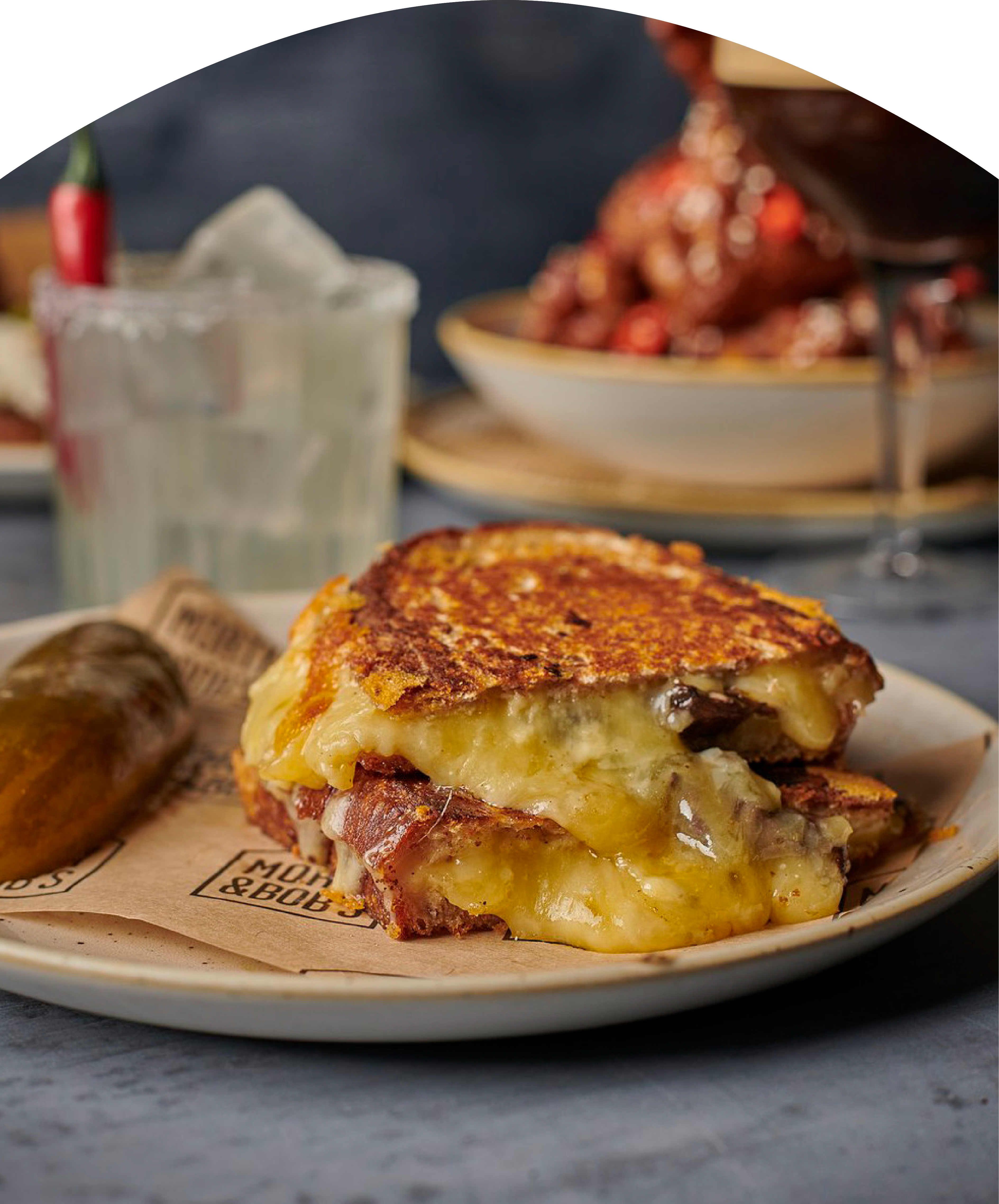 Melted cheese sandwich on a plate.