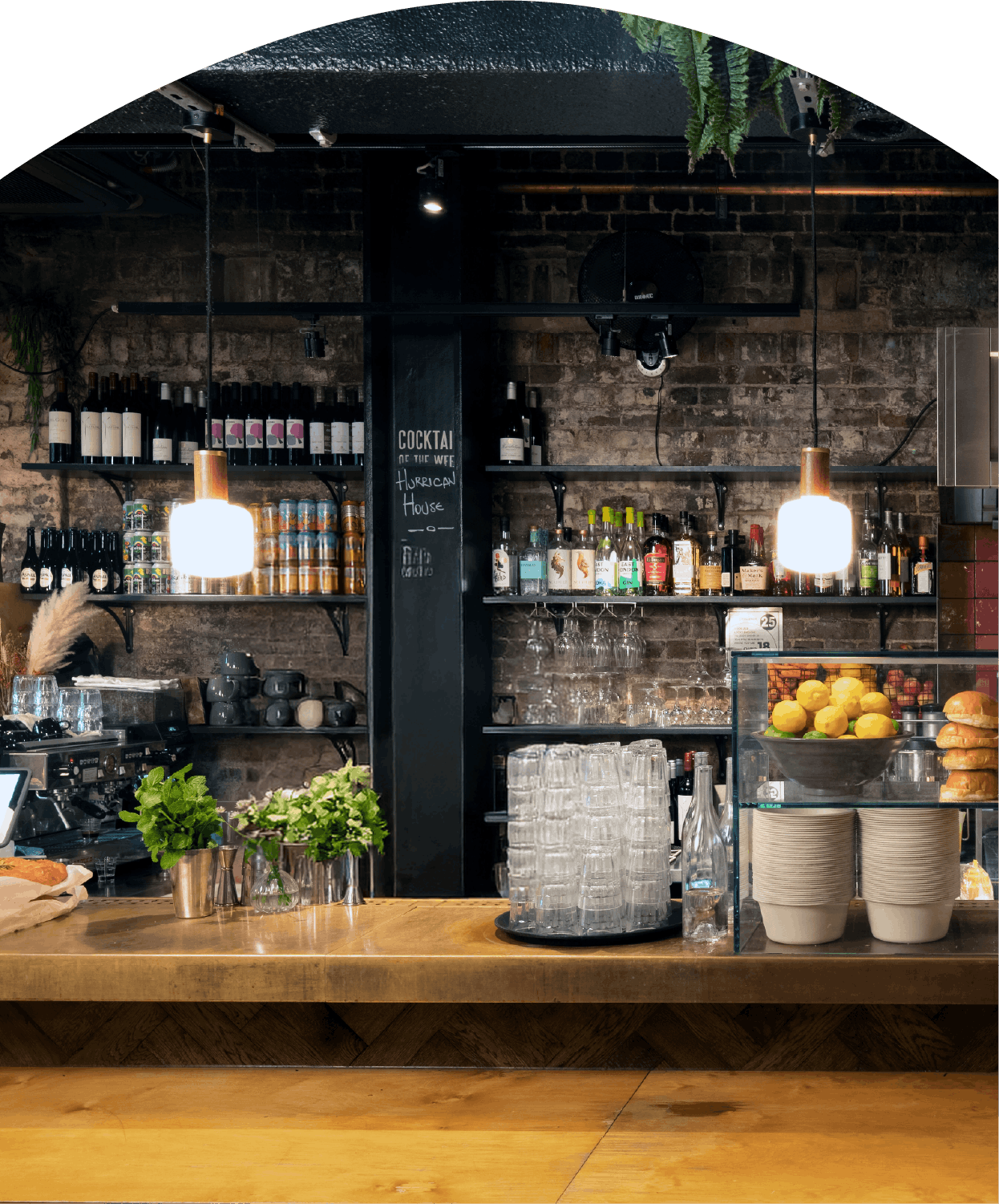 Cozy bar counter with hanging lights.