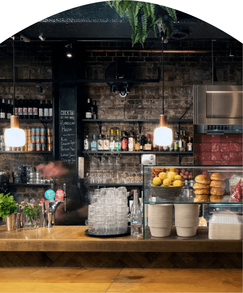 Cozy bar counter with hanging lights.