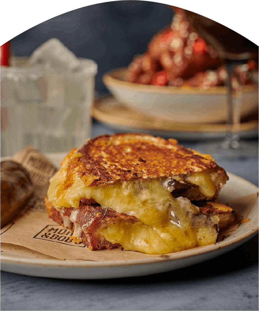 Melted cheese sandwich on a plate.