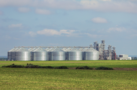 Frontline Freight Work Van in front of rural factory