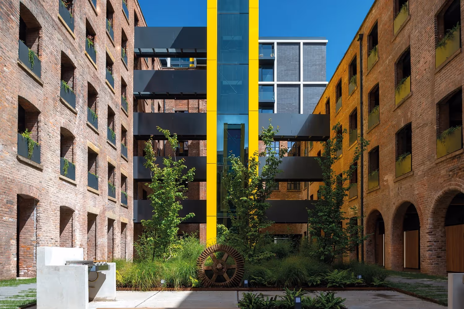 Outside Capital&Centric's Crusader Mill green courtyard