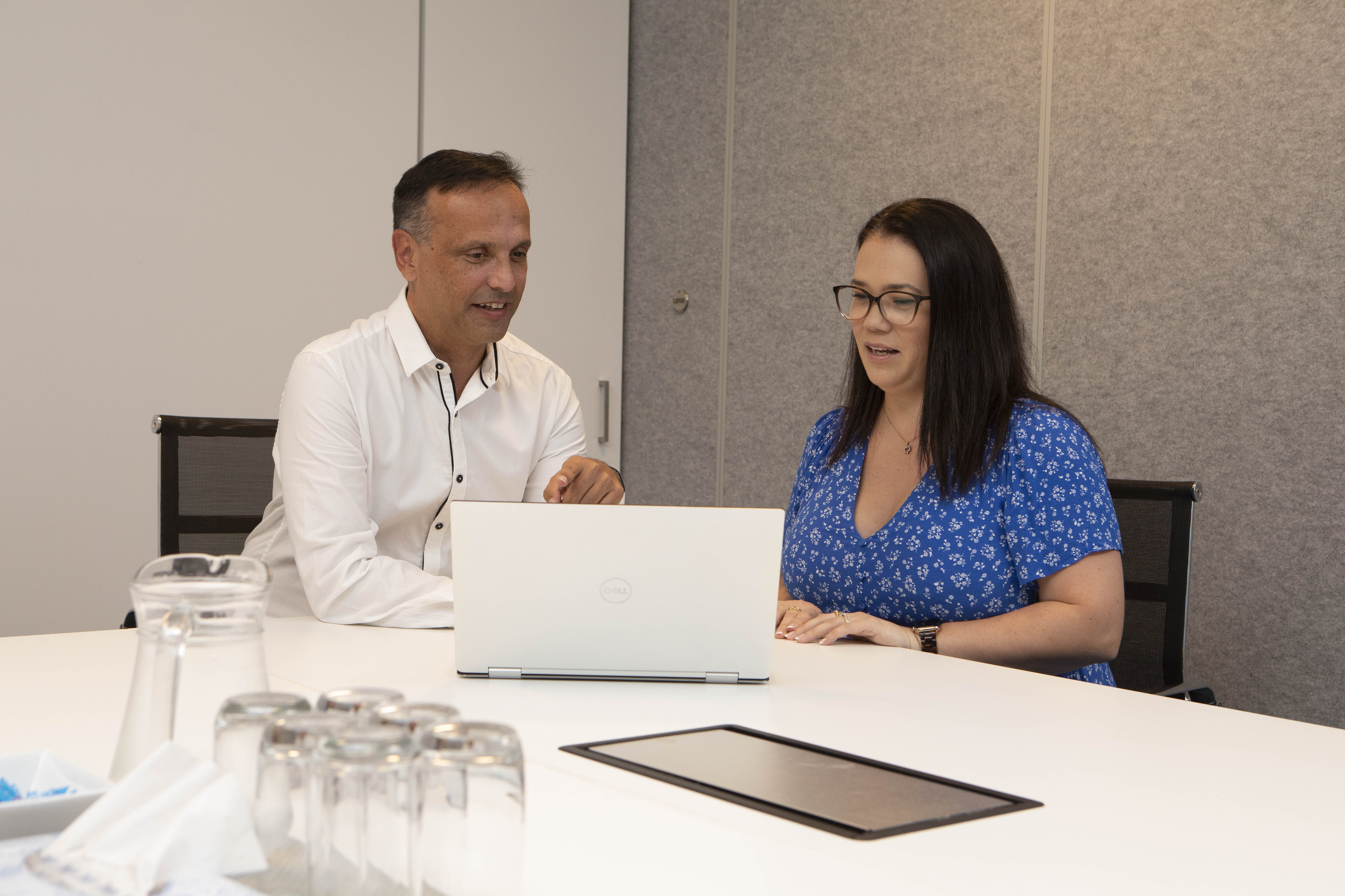 Financial consultant adbising client around goal setting.